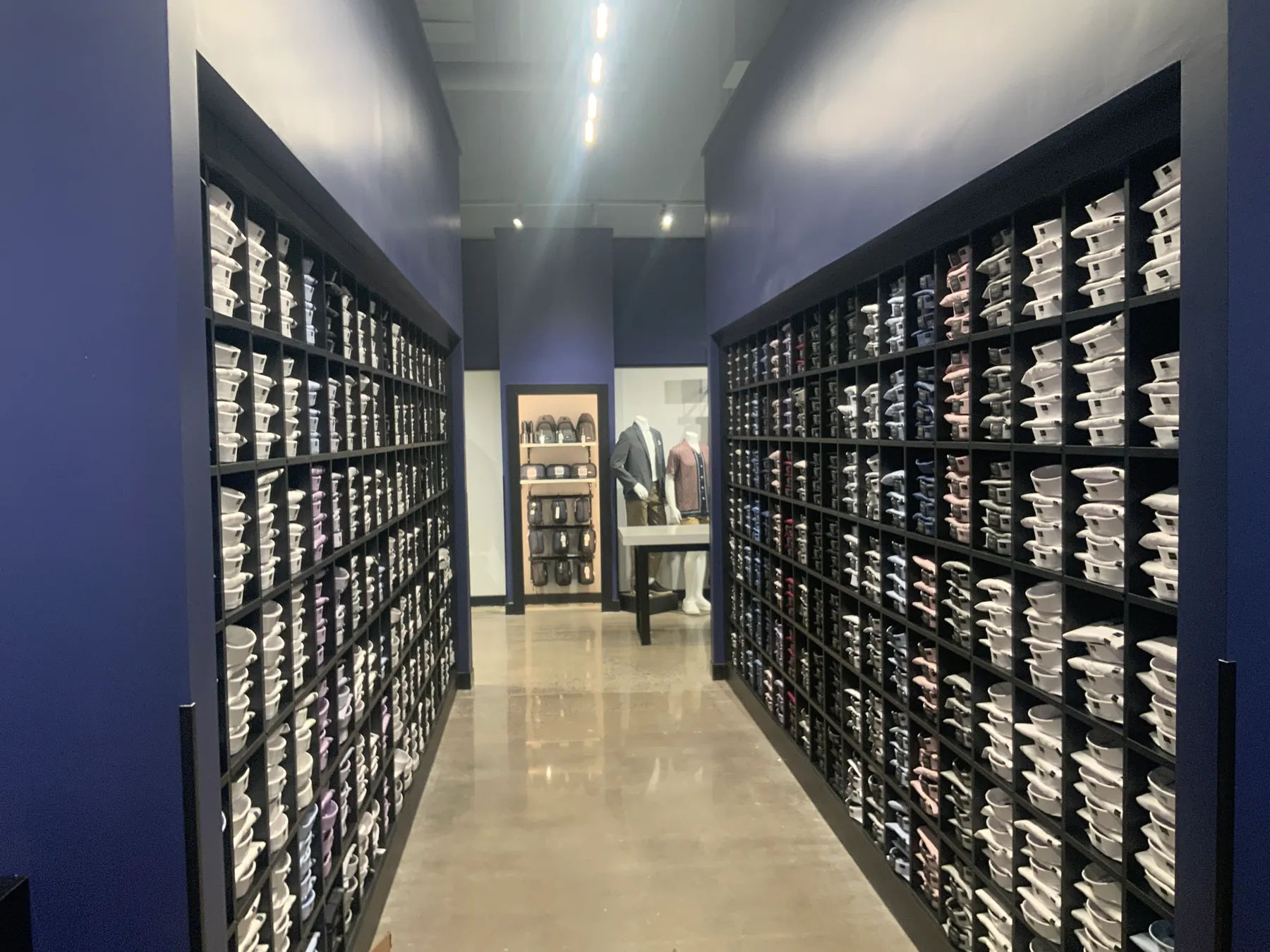 Men's Wearhouse dress shirt wall — floor-to-ceiling cubby fixtures