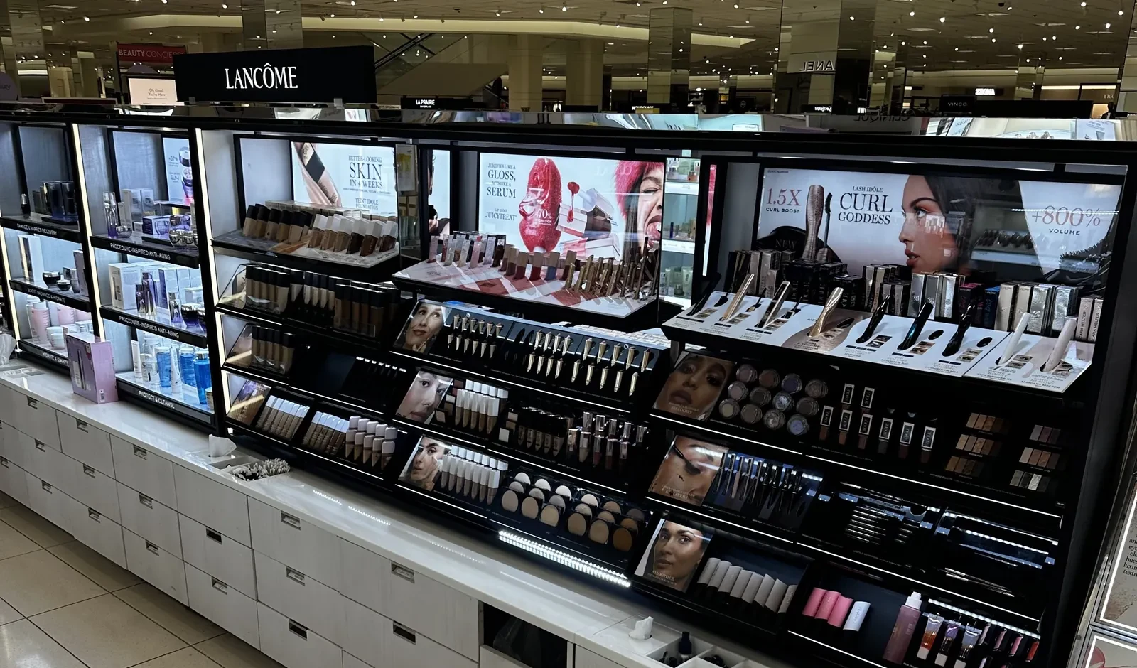 Nordstrom beauty refresh — completed cosmetics fixture wall with lighted displays